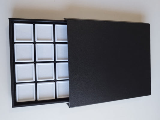 Black leather-style box with magnetic closure and sectioned interior. (23,5 * 19,5 * 3 cm)