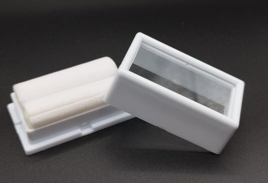 White rectangular plastic box with white bifurcated pad and top window  (5,2 * 2,8 * 2 cm)