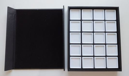 Black leather-style box with magnetic closure and sectioned interior. (23,5 * 19,5 * 3 cm)