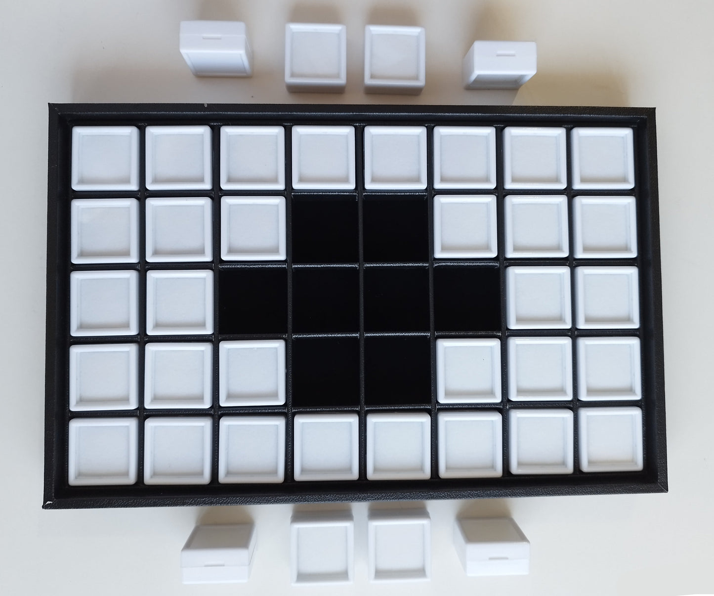 Black leather-style box with magnetic closure and sectioned interior. (28,5 * 19 * 3 cm)